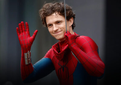 Tom Holland in Spider-Man Brand New Day suit on Glasgow set with flipped cars and NYPD props