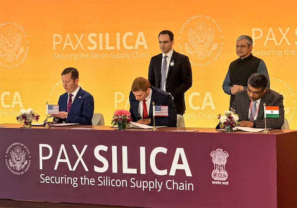 India US signing ceremony at AI summit Pax Silica declaration
Global AI Impact Summit New Delhi Pax Silica declaration partners
Officials discussing AI policy cooperation Pax Silica declaration