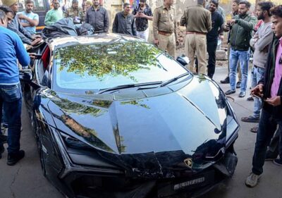 Lamborghini accident scene in Kanpur with damaged vehicles and crowd Kanpur Lamborghini crash